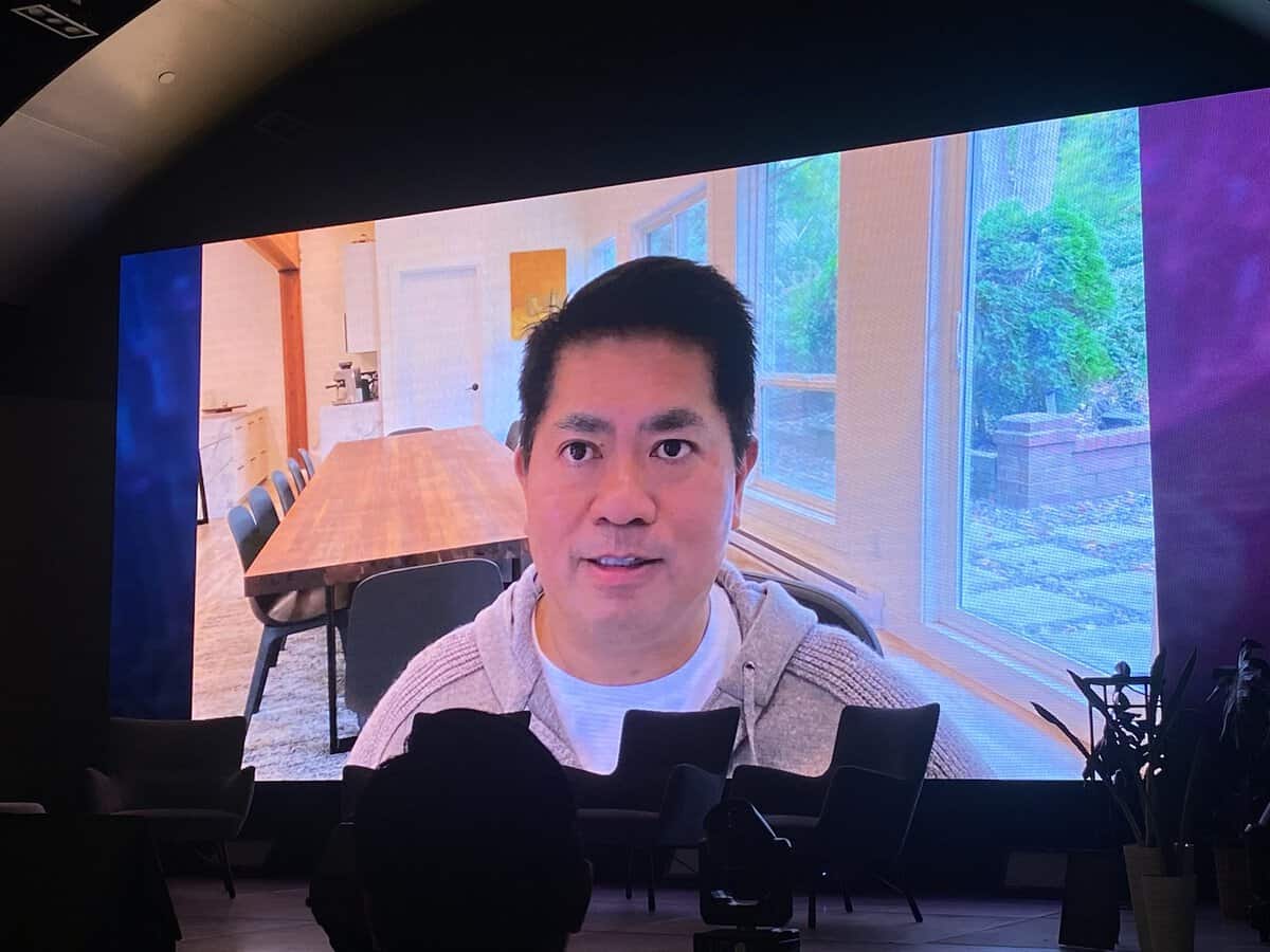 Paolo Kalaw appears by video on a large screen at the FutureProof Tech Summit
