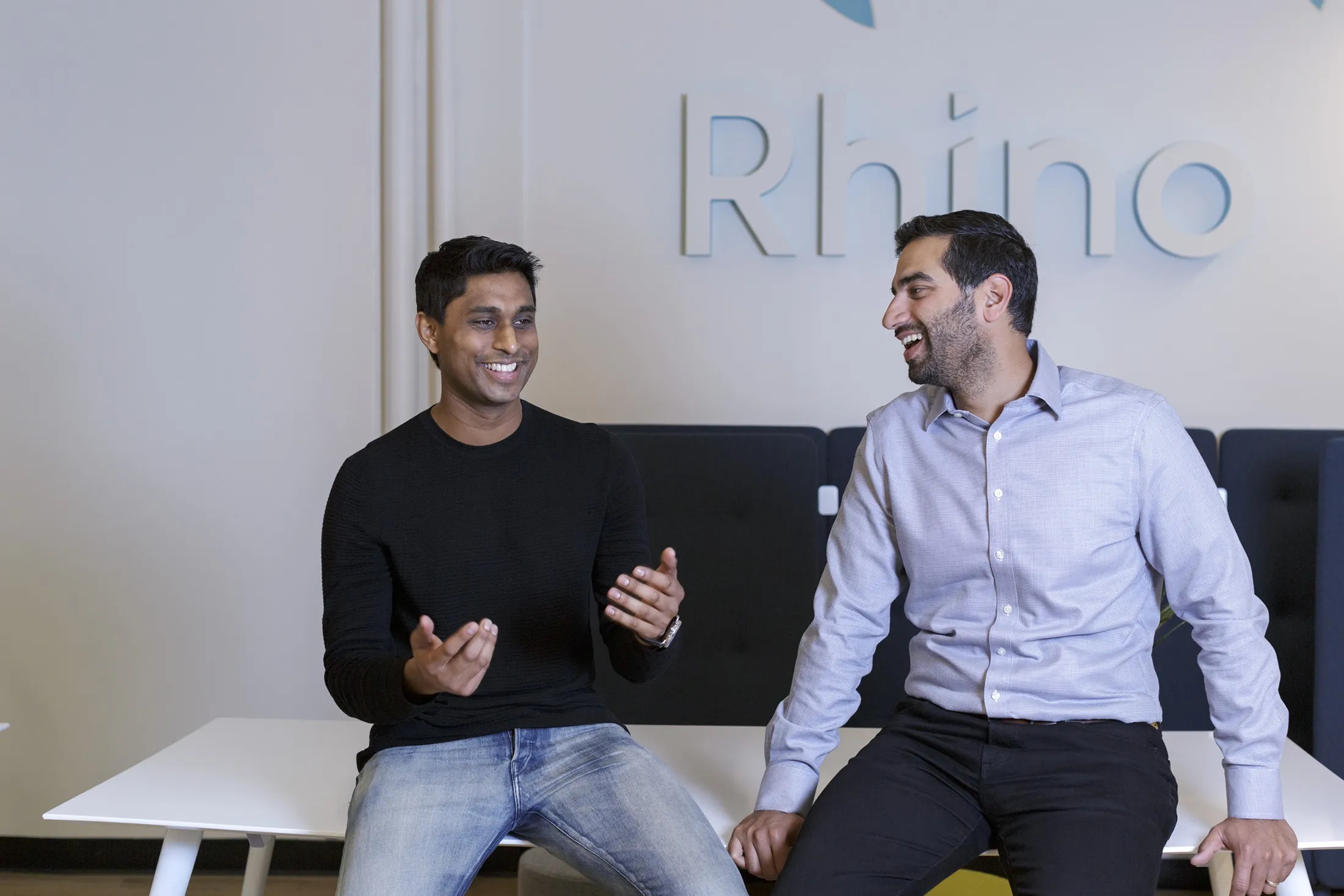 Ankur Jain on the left and Paraag Sarva on the right, talking at the Rhino office
