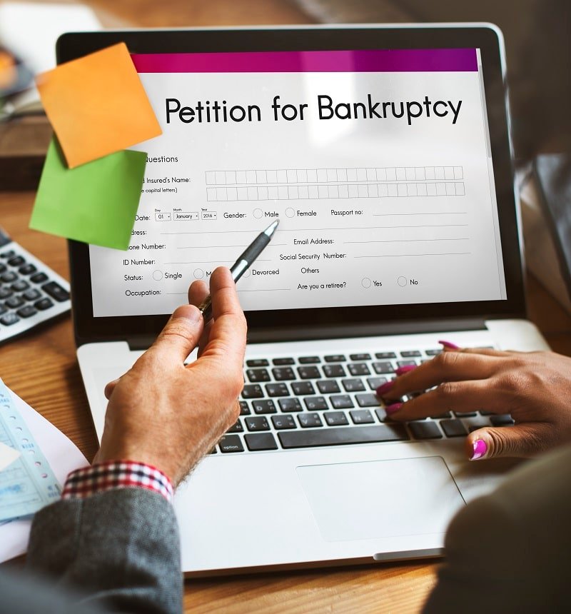Illustrative photograph from Rantz’s website showing bankruptcy paperwork on a laptop