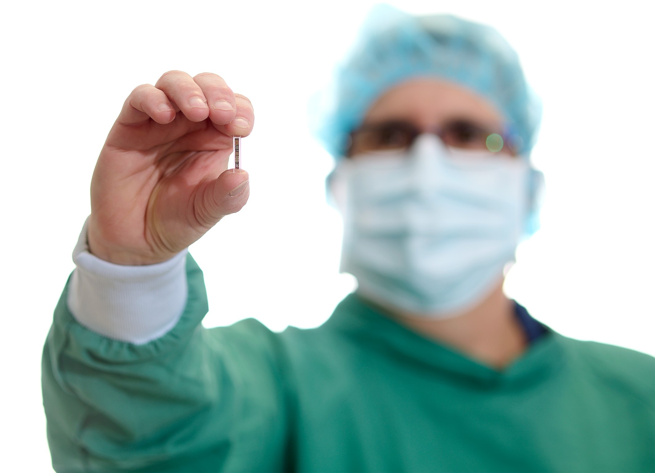 Kitea Health preclinical scientist Sarah-Jane Guild holding a tiny implantable pressure sensor