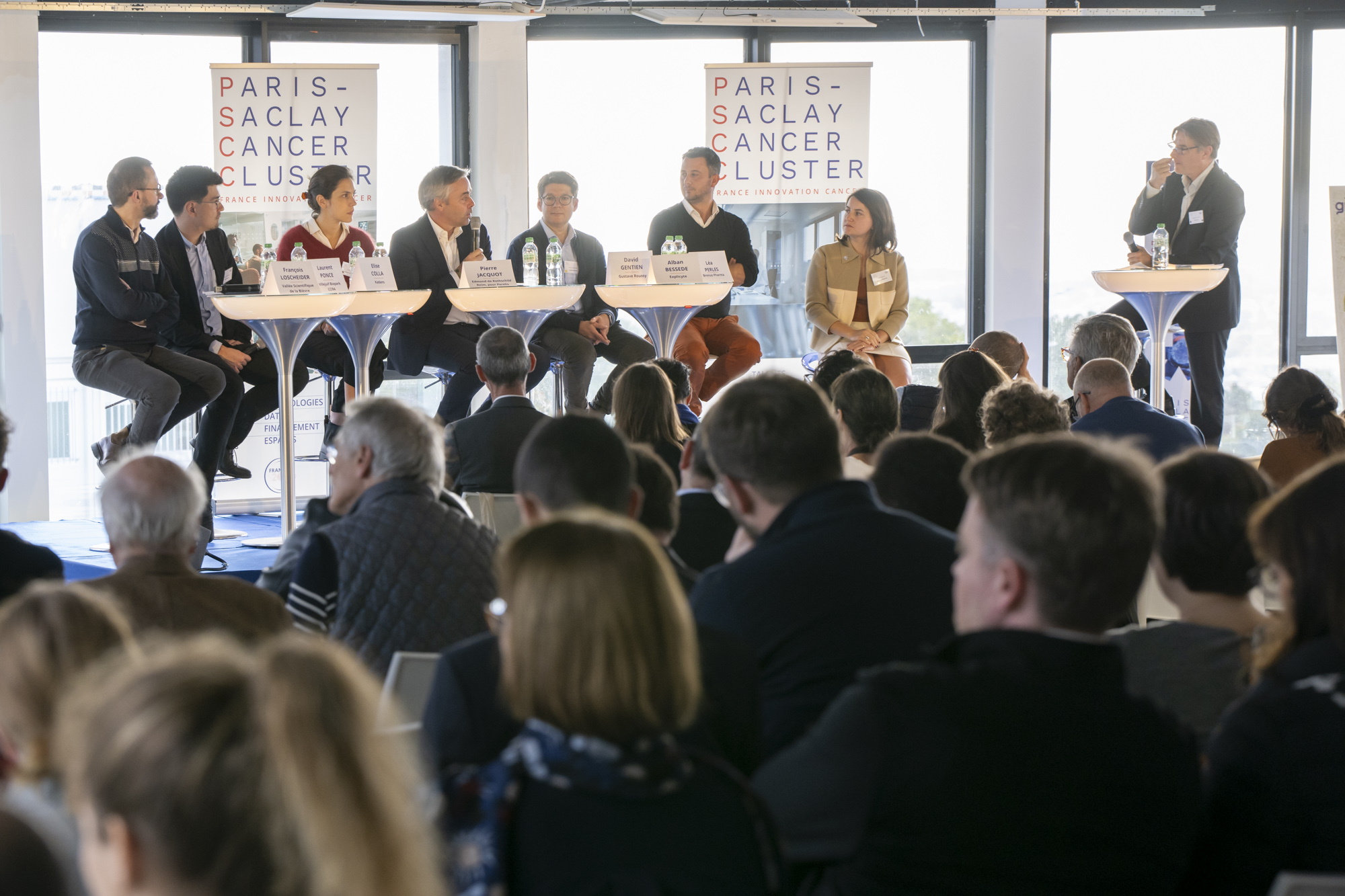 A panel discusses oncology innovation before an audience at PSCC’s 2024 Innovation Forum