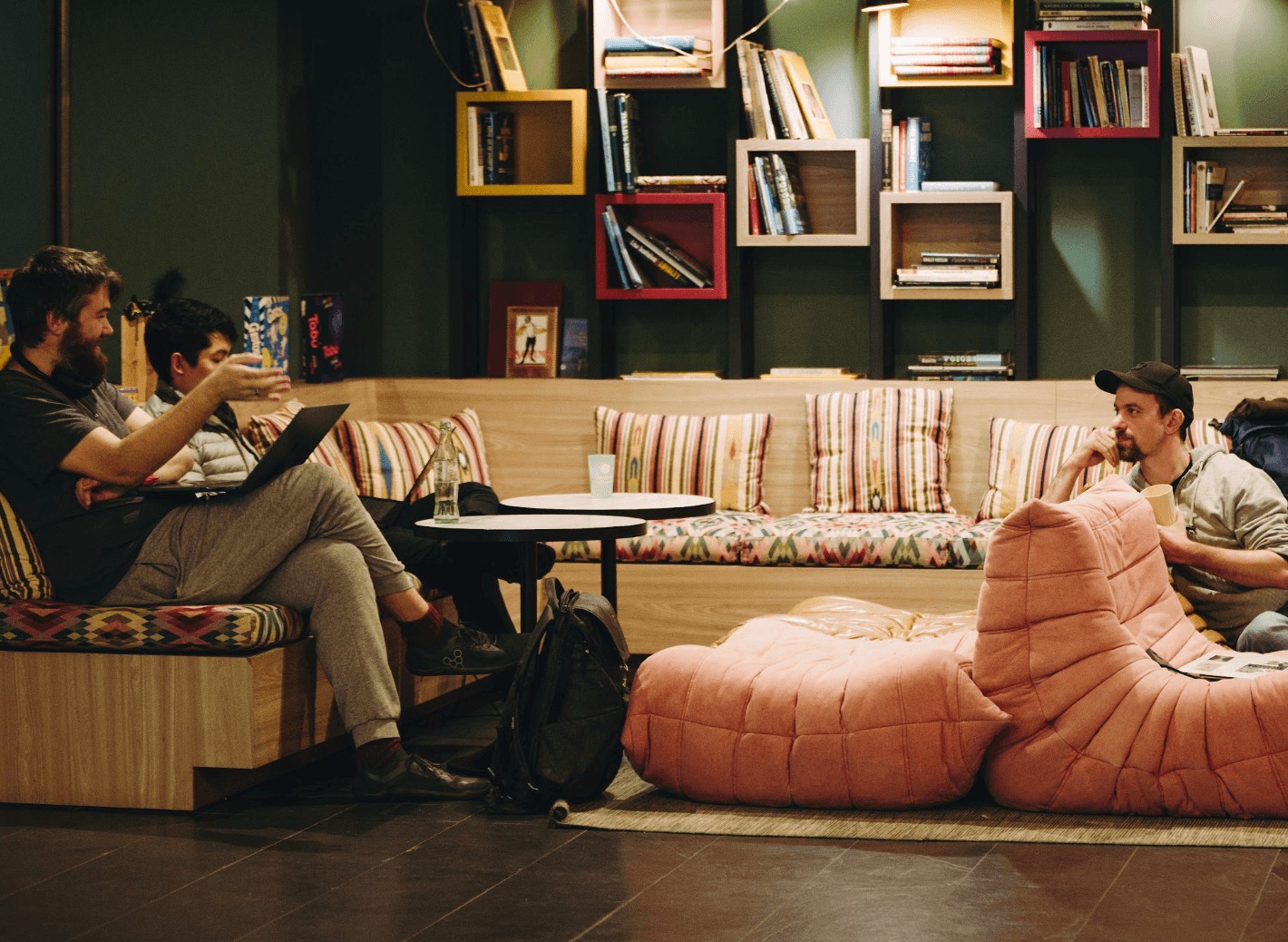 People with laptops talking in a lounge, in an image published on Parity’s careers page