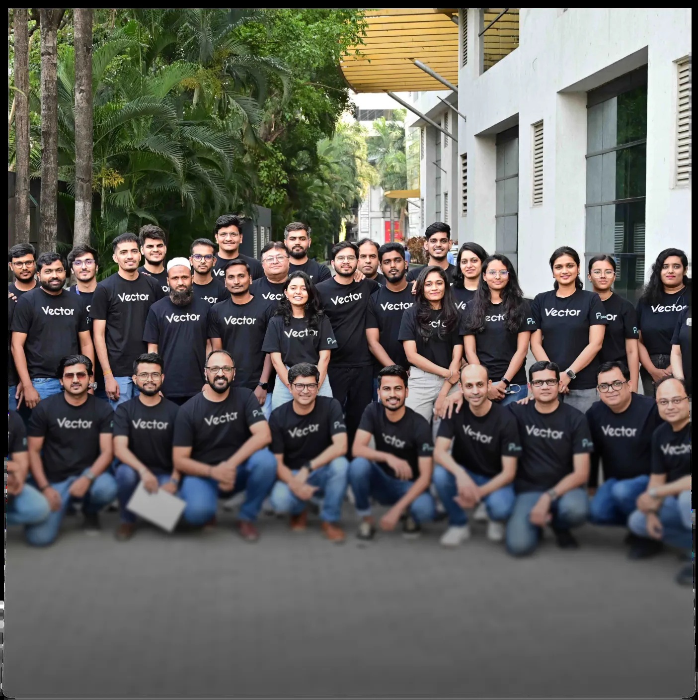 Parkar team members gathered outdoors wearing Vector T-shirts