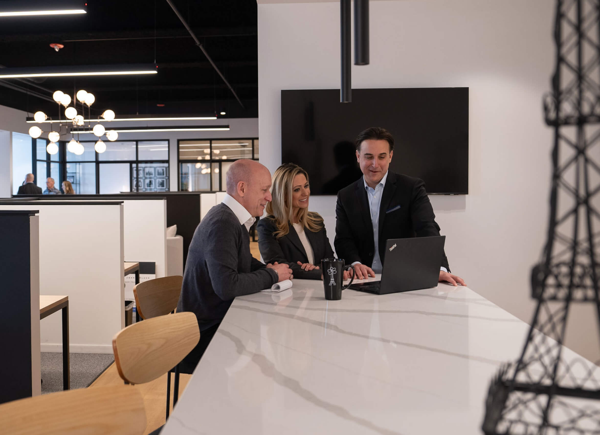 Parris Communications colleagues working together around a table in the Kansas City office