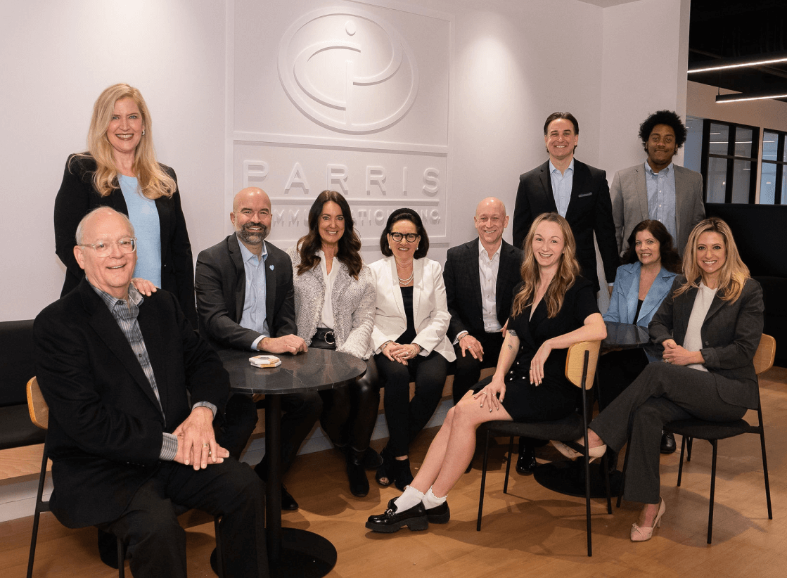 The Parris Communications team gathered in front of the company sign