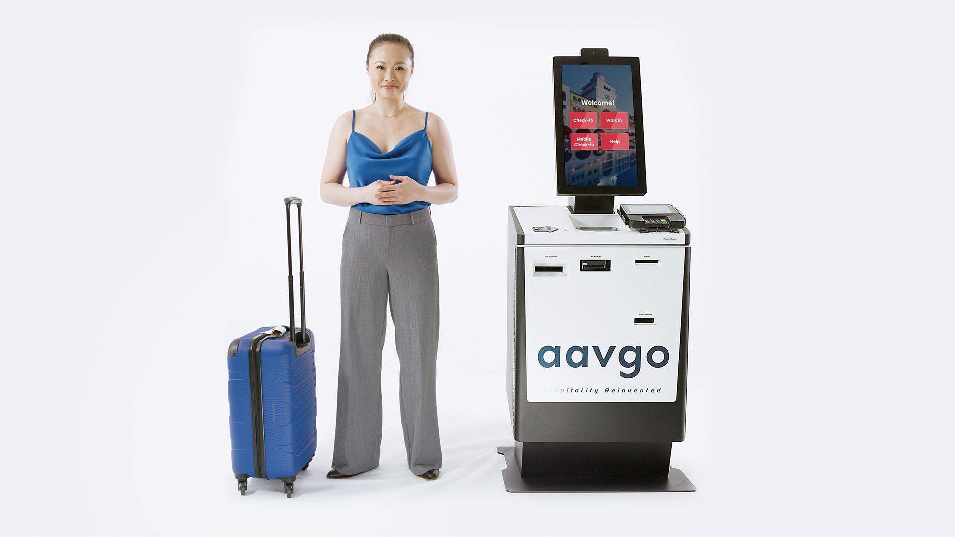 Aavgo Smart Reception kiosk beside a traveler with luggage
