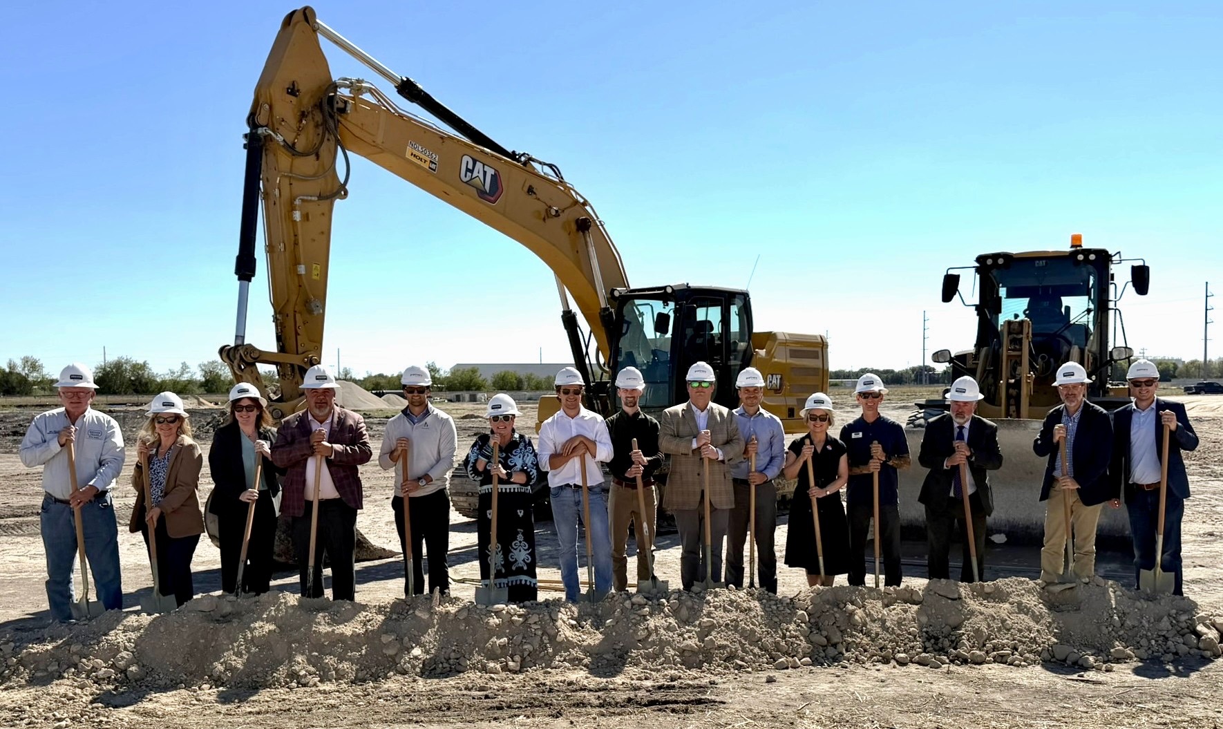 Partners and community representatives with shovels at the Seguin Commerce Park groundbreaking
