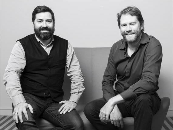 Pascal Gauthier and Éric Larchevêque seated together in a black-and-white photograph from Ledger's 2017 appointment announcement