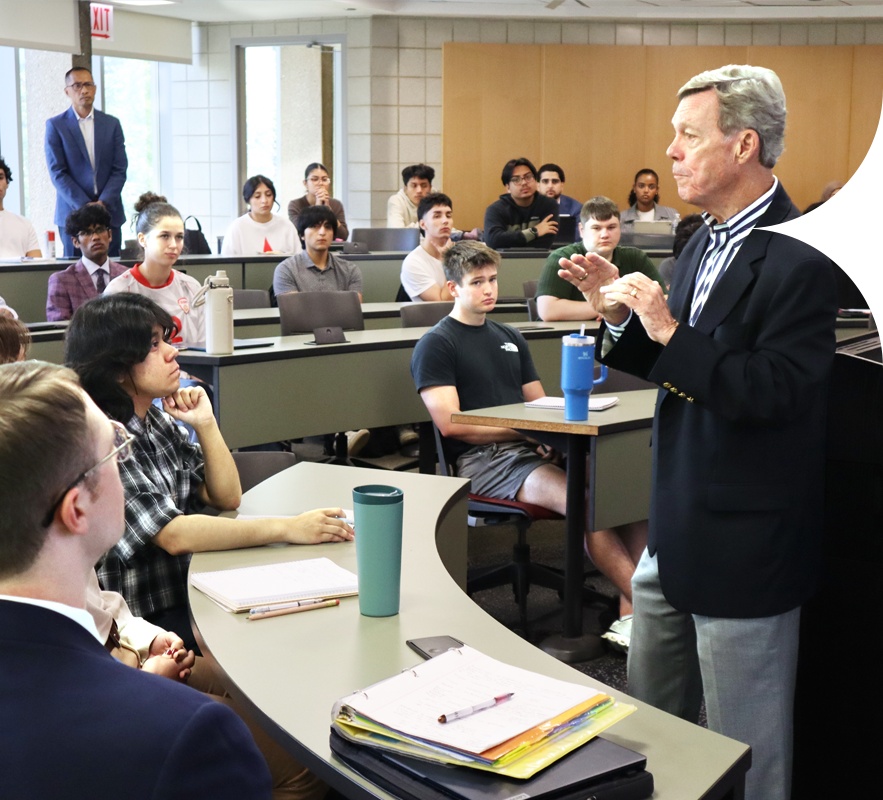 Pat Gallagher speaking with students in a University of Illinois Chicago business classroom