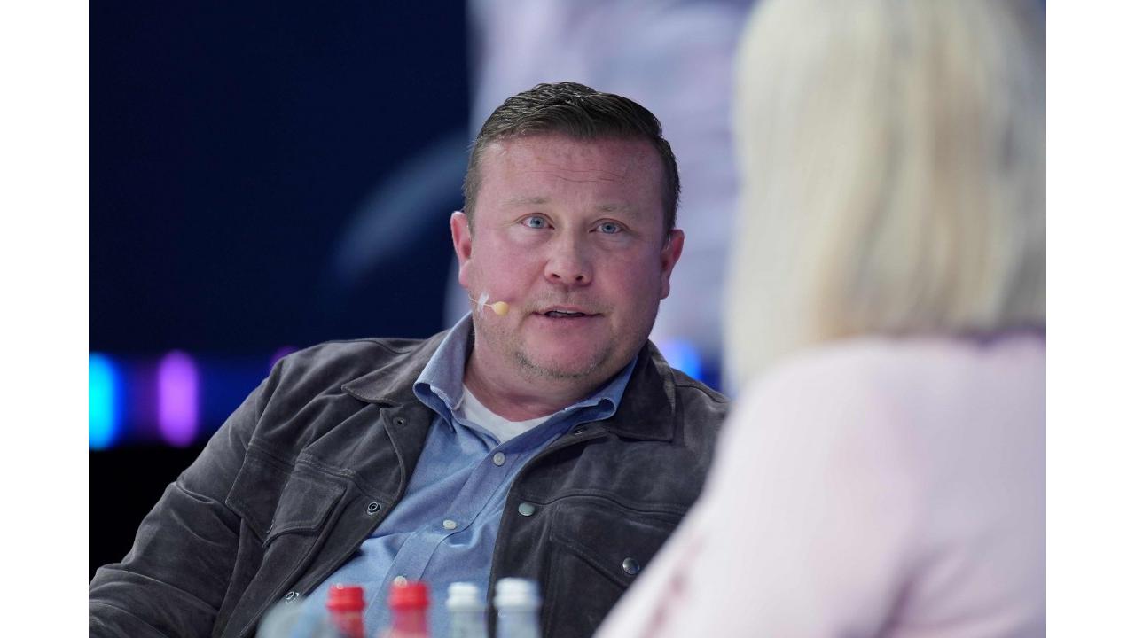 Patrick Dennis wearing a headset microphone during a discussion at GITEX Global 2024 in Dubai