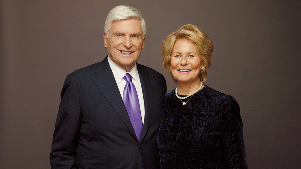 Patrick and Shirley Ryan standing together, Patrick wearing a purple tie