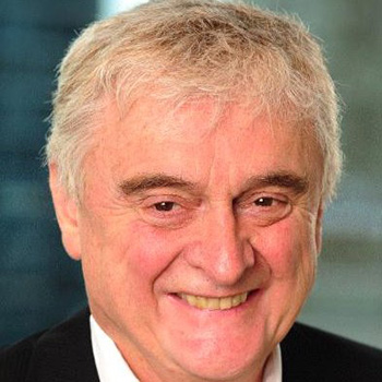 Paul Barber smiling in a separate portrait accompanying his published essays