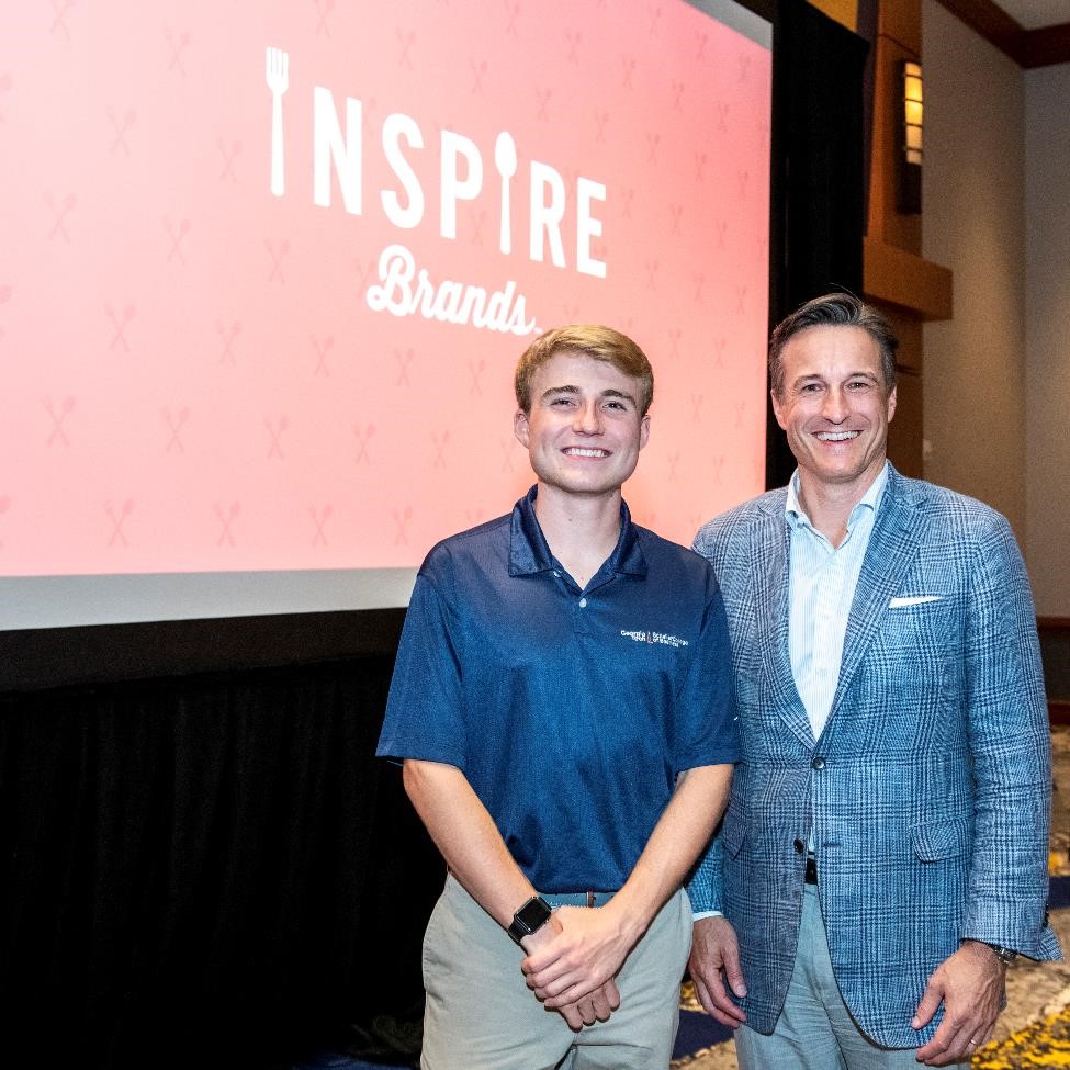 Georgia Tech student Cole Ormsby, left, with Paul Brown at Scheller’s 2018 Opening Bell event