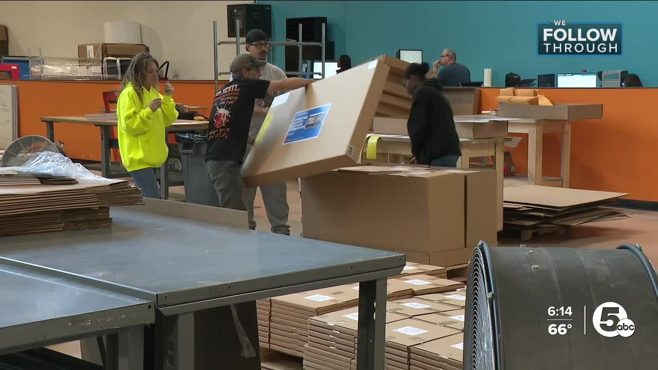 OnQ employees assembling and packing retail displays in the former Chapel Hill Mall