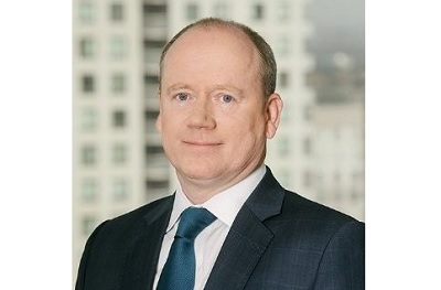 Paul Cosgrove in a suit and blue tie, in the press photograph accompanying his 2020 appointment