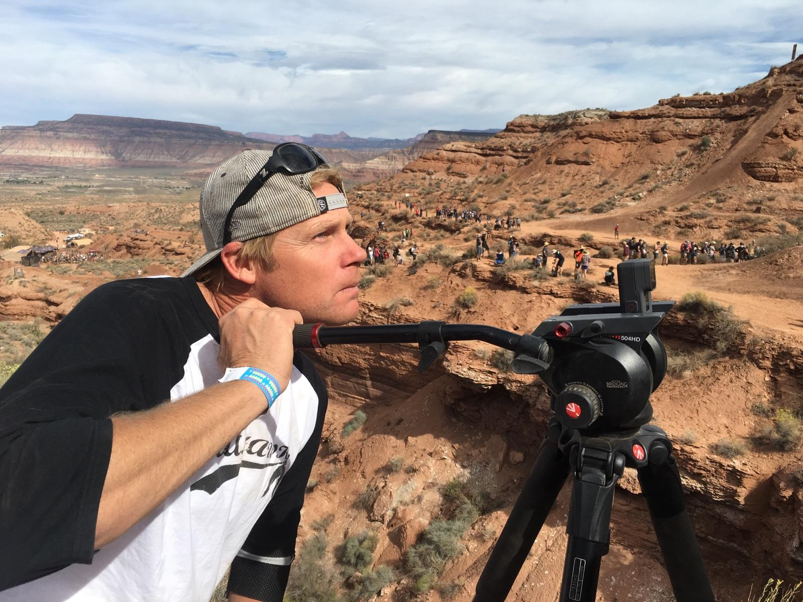 Paul Crandell looking toward a GoPro camera on a tripod at Red Bull Rampage