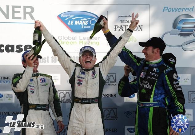 Paul Drayson celebrates on the Road America podium with Jonny Cocker to his left in August 2010