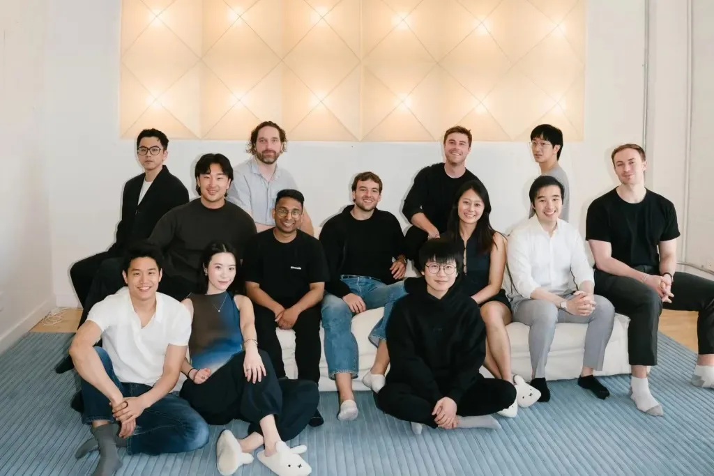 Paul Erlanger, seated near the center, with members of the fomo team