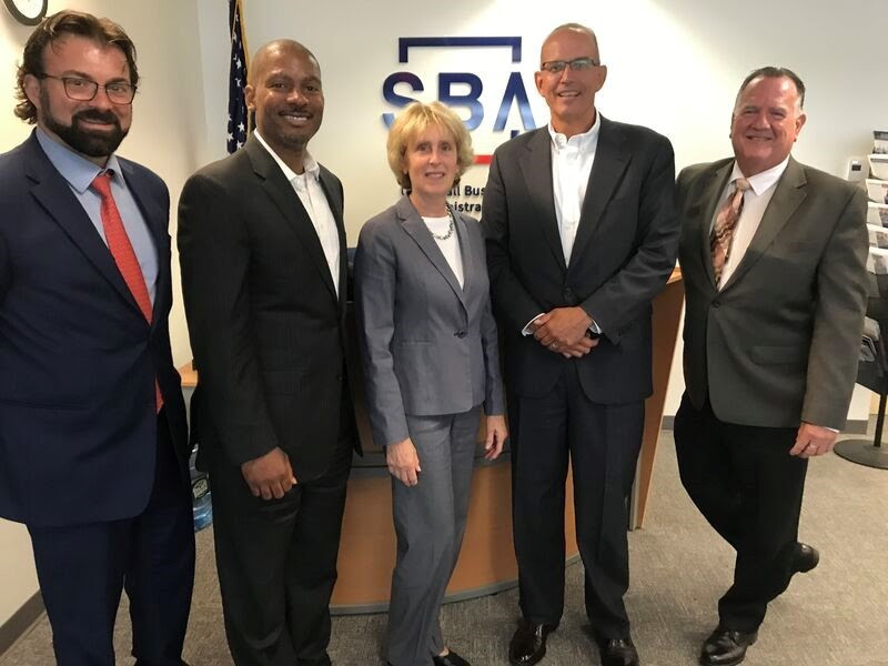 Paul Flynn, second from right, with BDC Community Capital and SBA colleagues at an office meeting