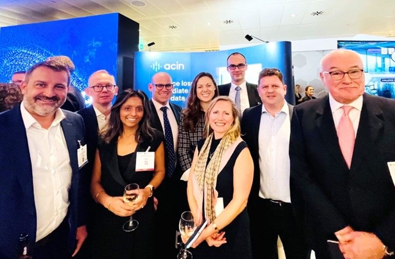 Paul Ford with the Acin team and guests at the company's XLoD conference stand in 2023