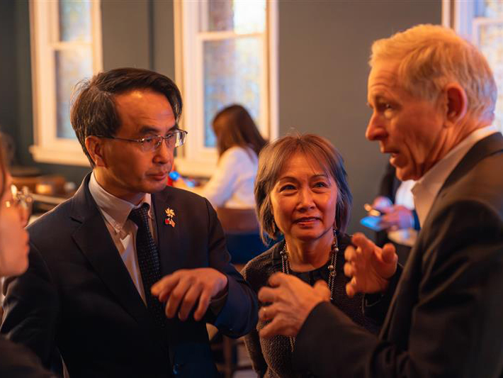 Paul Graziani, at right, talking with attendees at an industry gathering