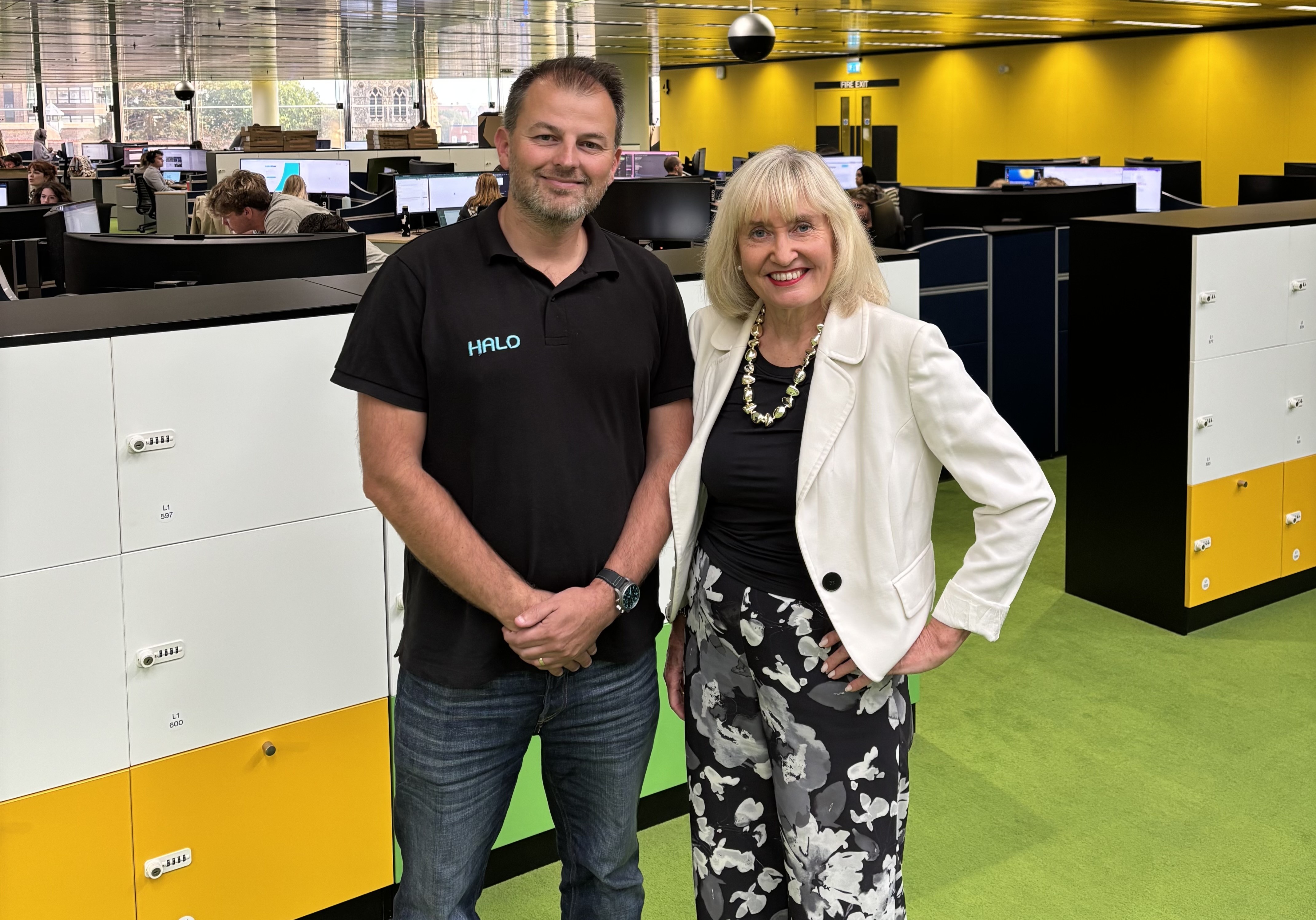 Paul Hamilton and Professor Jenny Higham standing together in Halo’s open-plan office