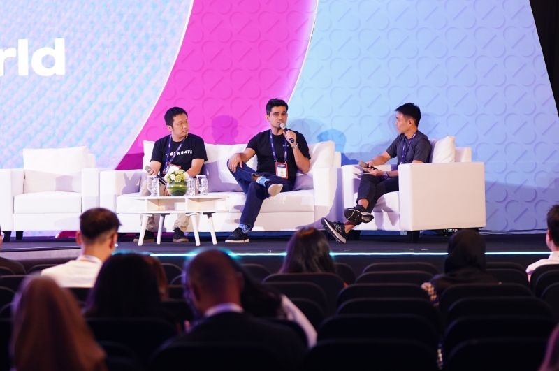 Paul Meng, left, with Abheek Anand, centre, and Willis Wee, right, onstage at Tech in Asia Conference in Jakarta in October 2023