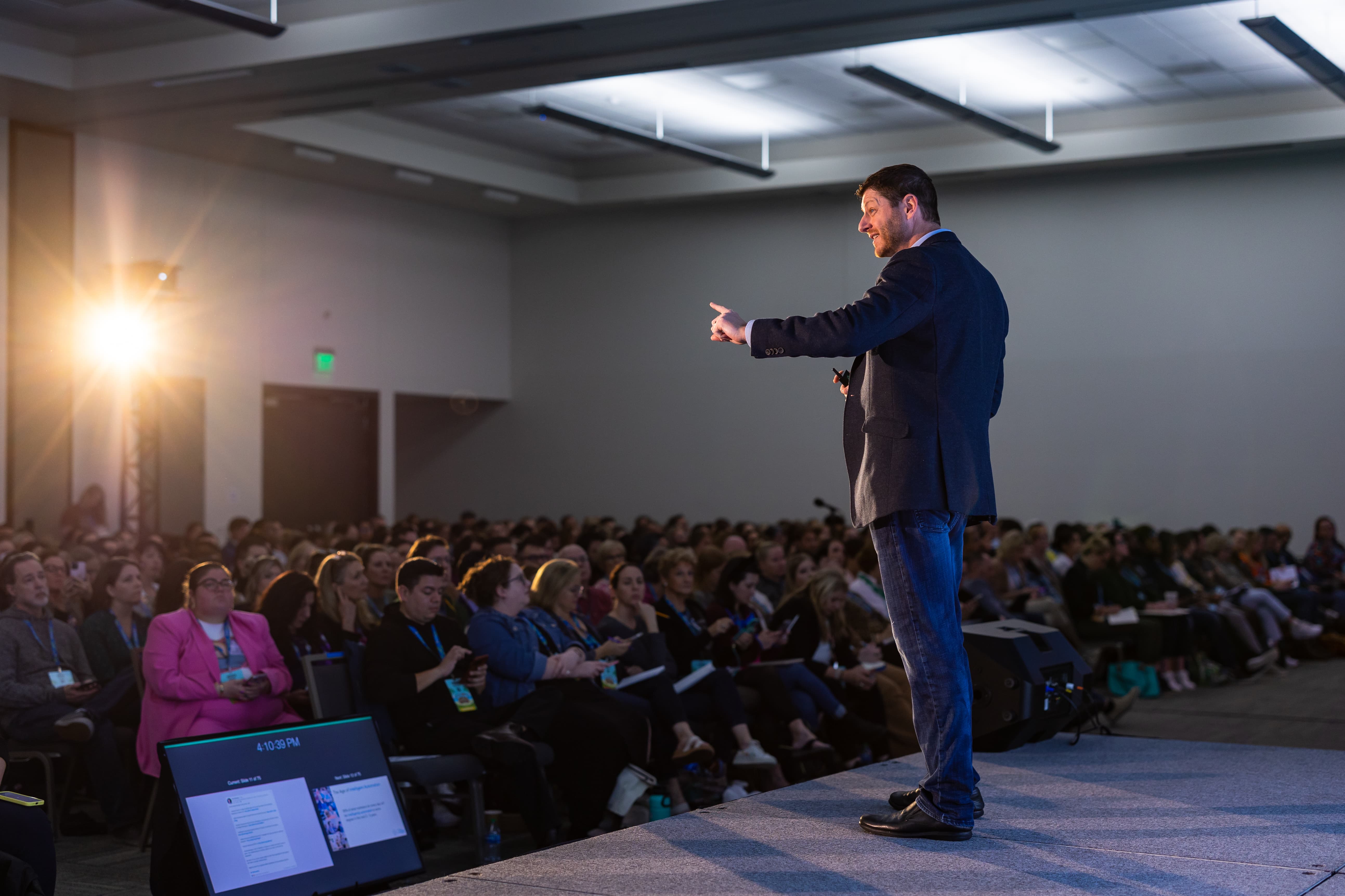 Paul Roetzer speaking on a stage in front of a seated conference audience