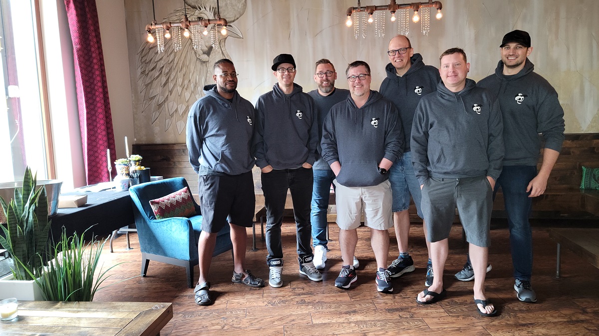 Paul Sage with Ruckus colleagues in a casual group photograph