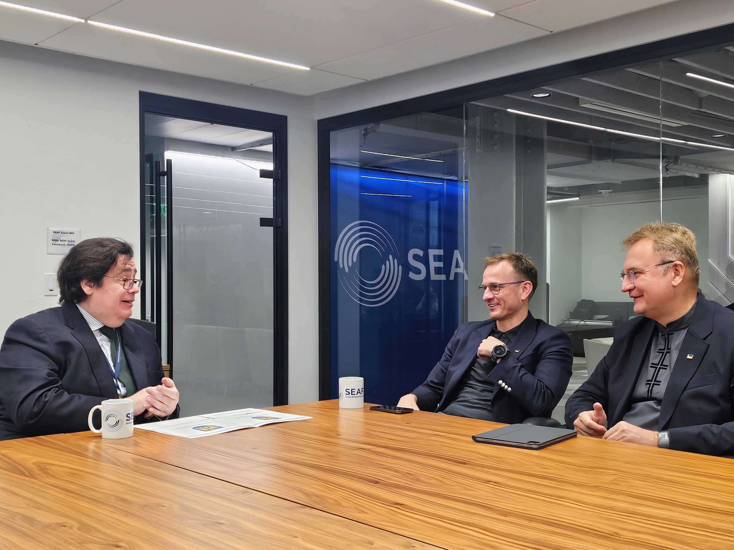 Paul Sheehan meeting Lviv government officials around a conference table at SEAF headquarters