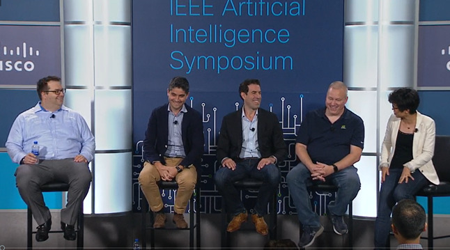 Paul Sinaï seated with panelists at the 2019 IEEE Artificial Intelligence Symposium hosted at Cisco