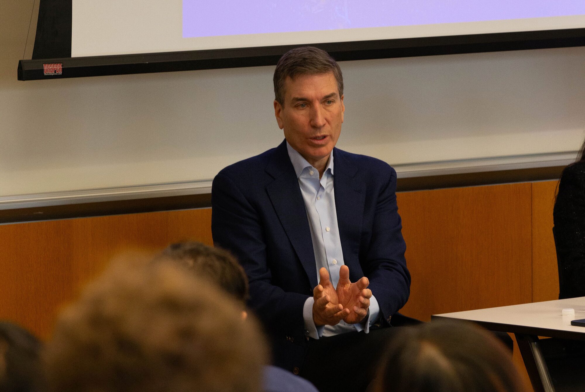 Paul Taubman gestures while speaking to students at Wharton