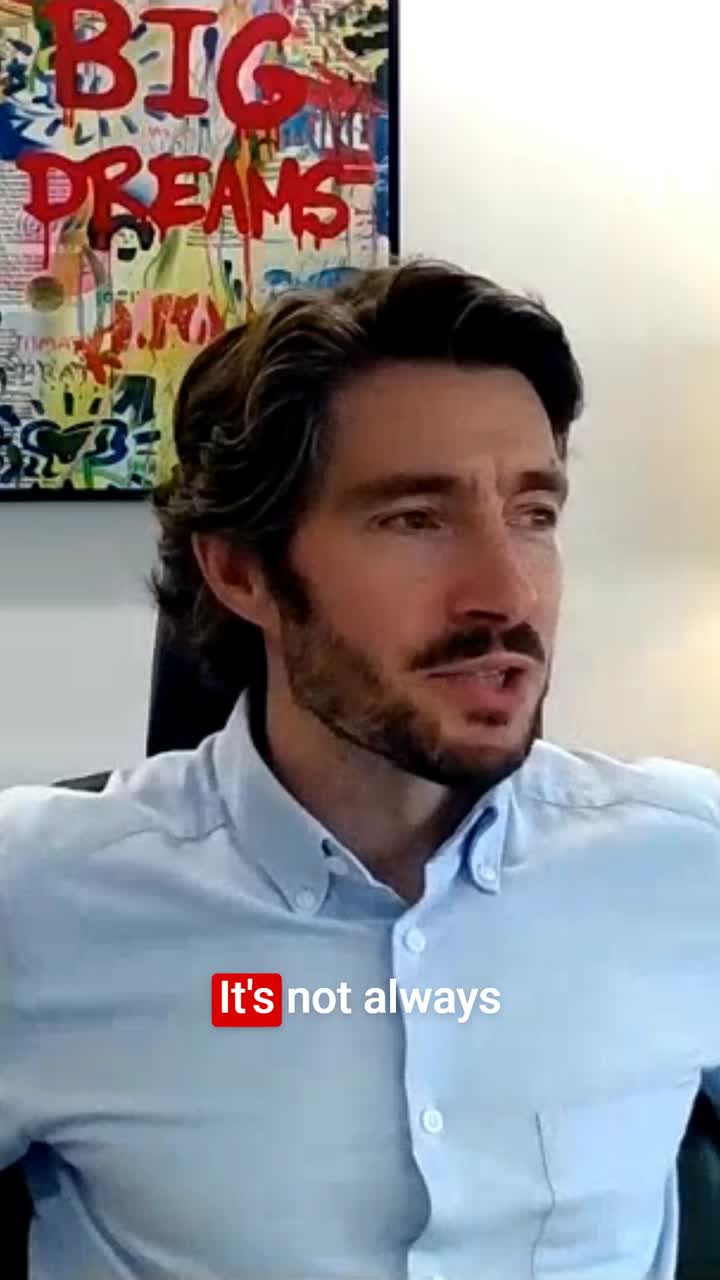 Paul Thomas speaking during a B2B Sales Playbook interview, with Big Dreams artwork behind him