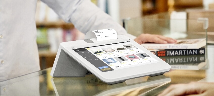 PAX E700 Mini point-of-sale system in a commercial setting