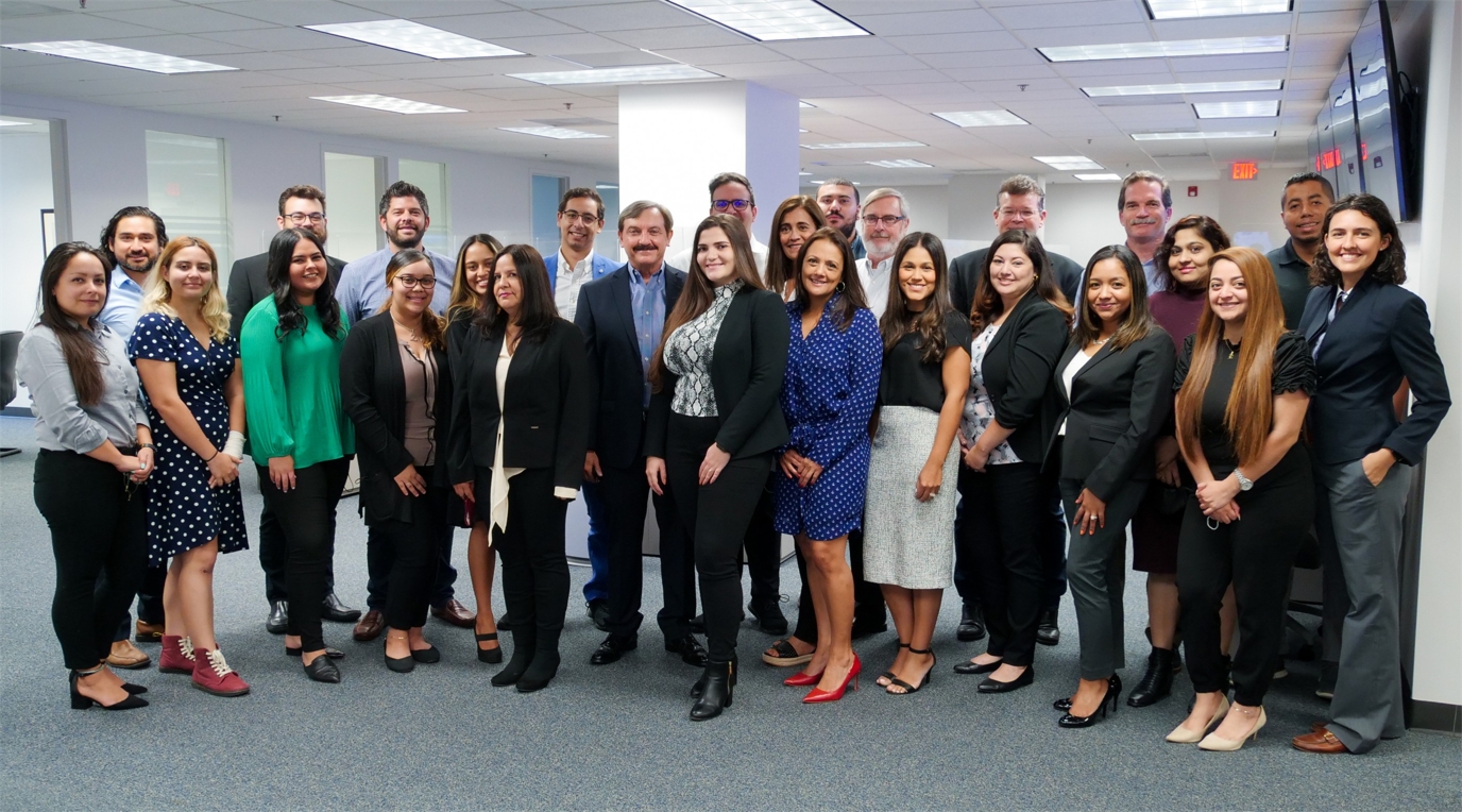 PayCargo employees gathered for a group photograph in their office