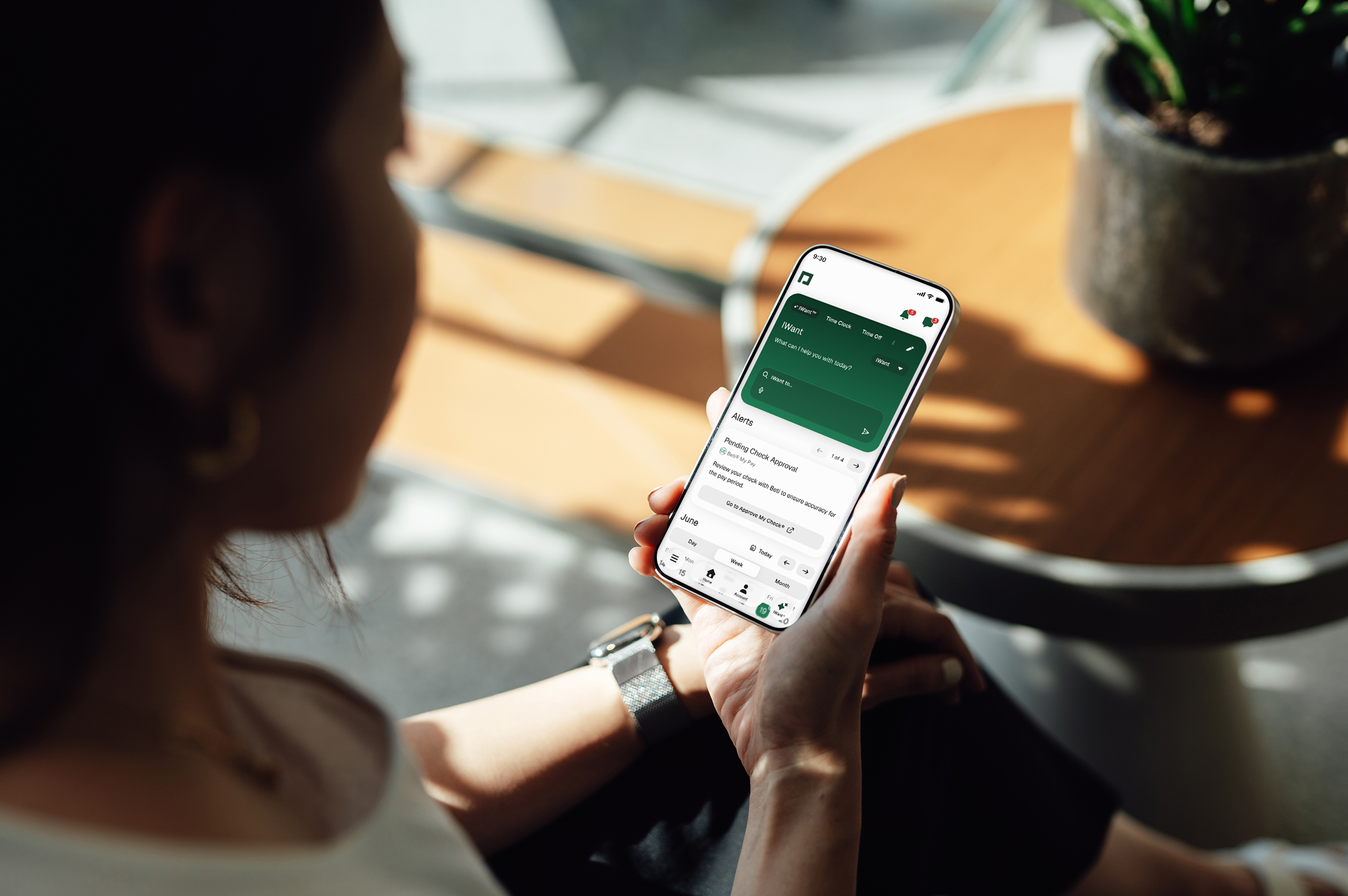 An employee using Paycom’s Employee Self-Service application on a smartphone