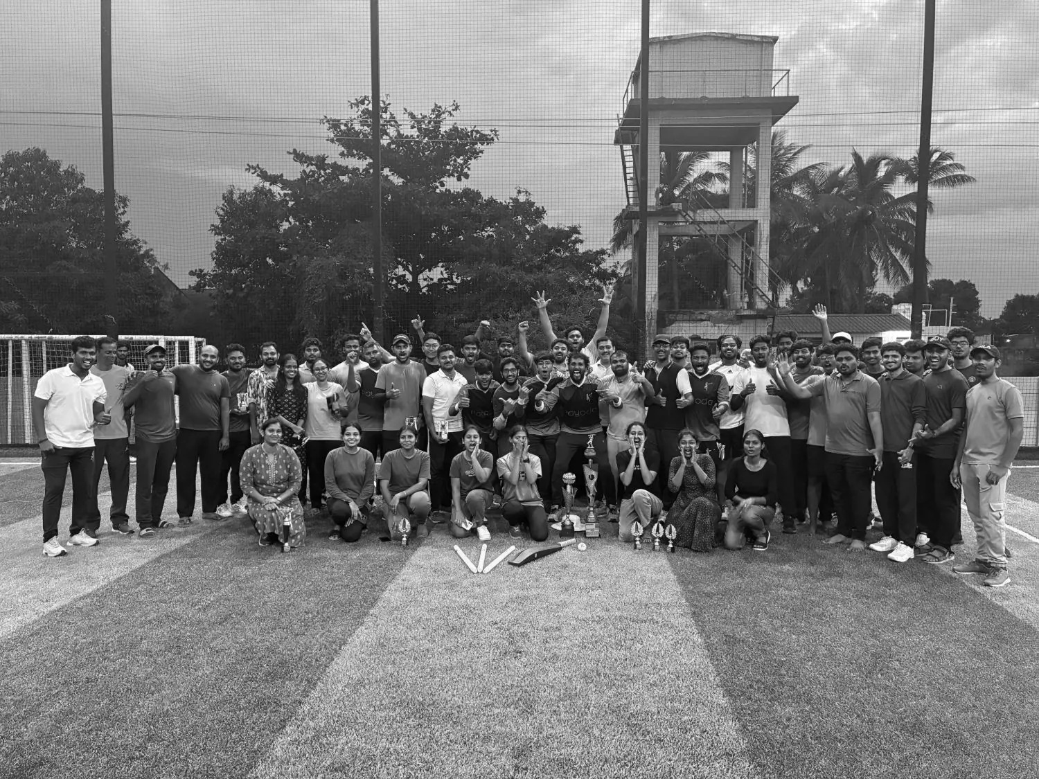 Payoda employees gathered outdoors after the company cricket league