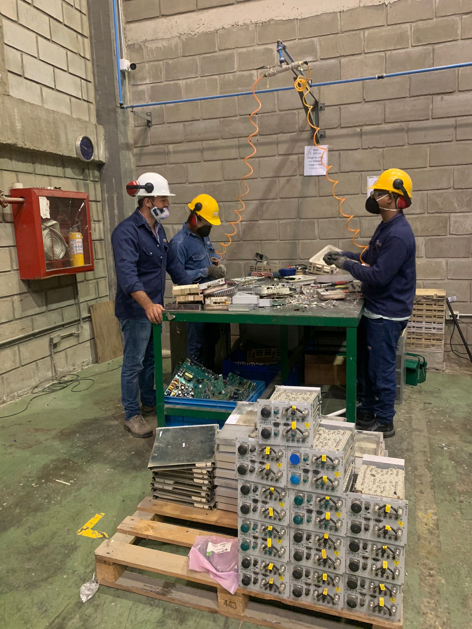 Peachtree Networks team dismantling retired telecom equipment
