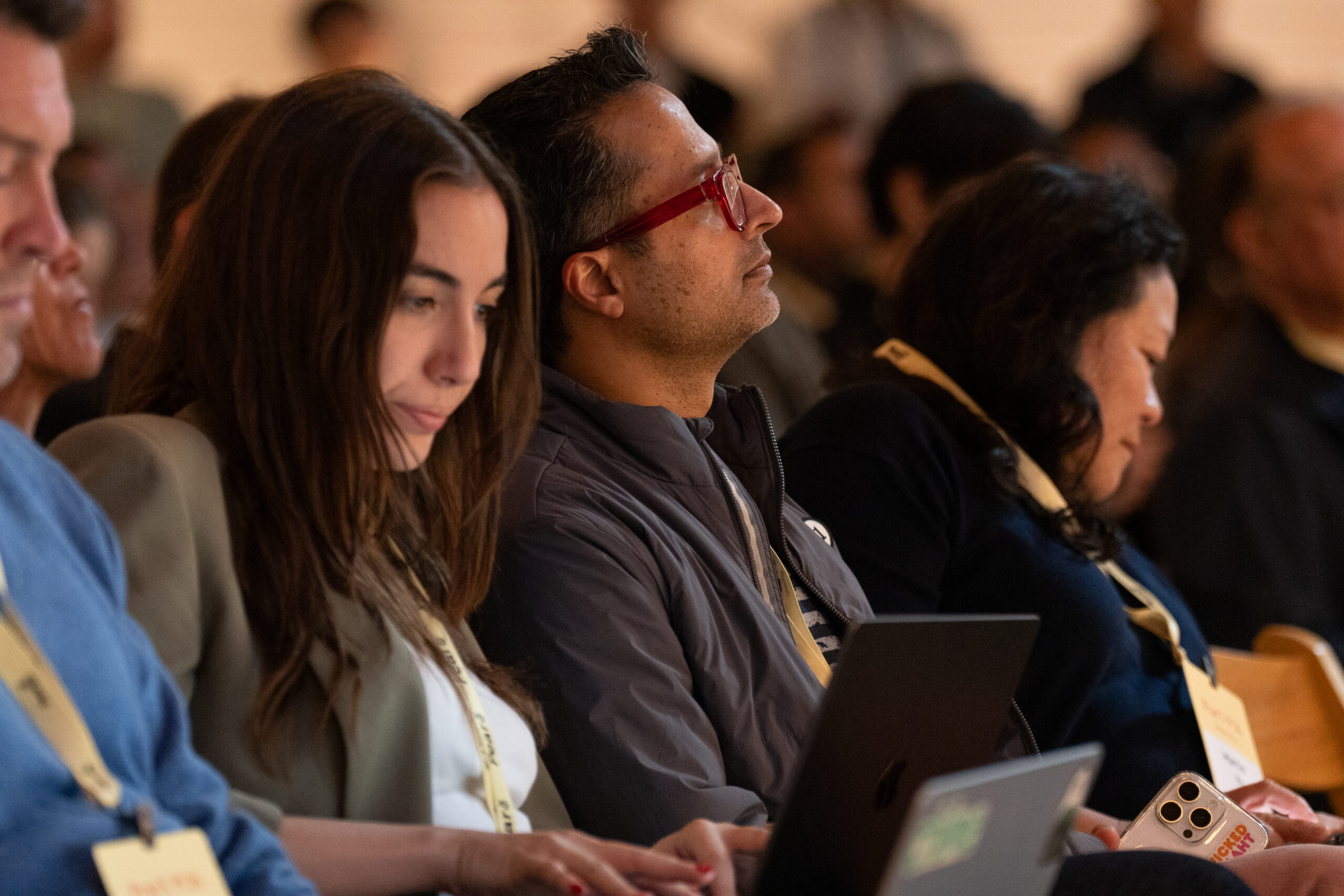 Audience members listening at a PearX Demo Day