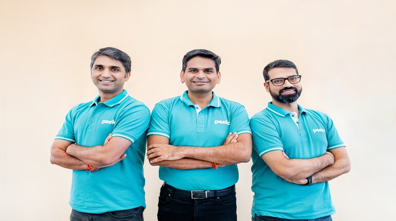 Peeko founders Chetan Sharma, Vivek Khetan and Abhijit Gairola wearing teal Peeko shirts