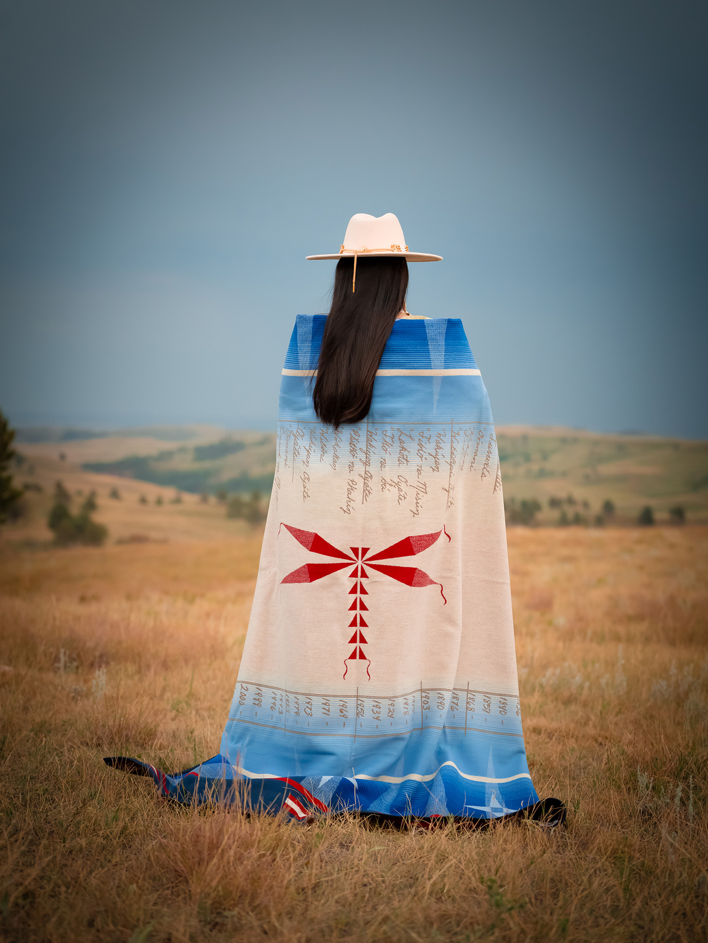 Belle Brings Plenty holding her Journey blanket