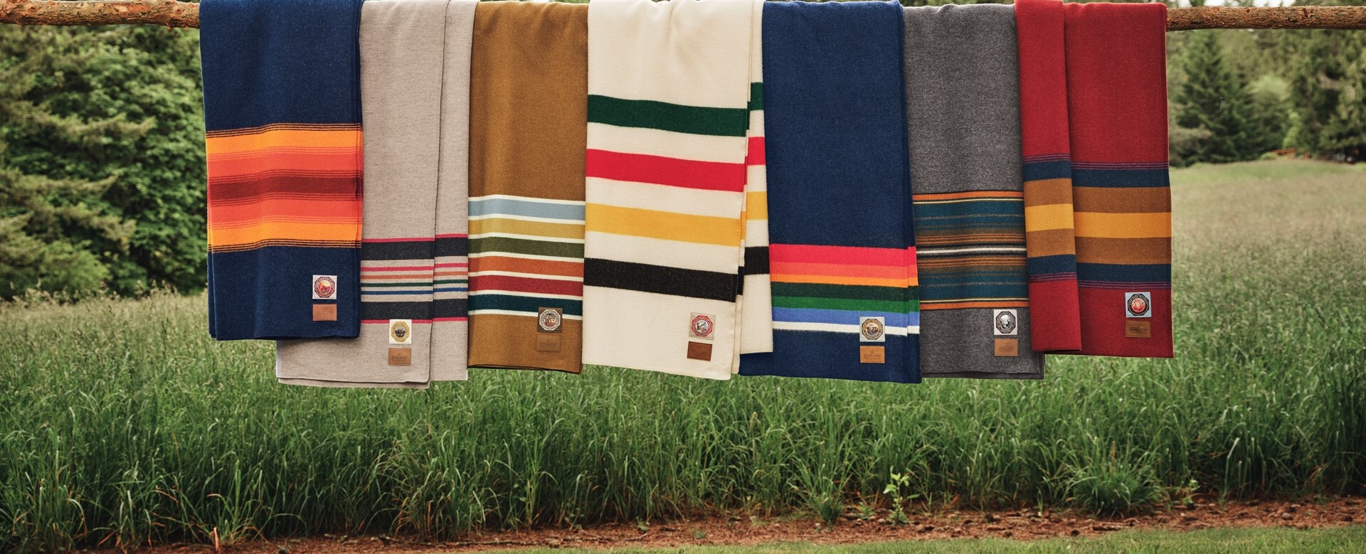 Pendleton National Park blankets draped over a wooden fence