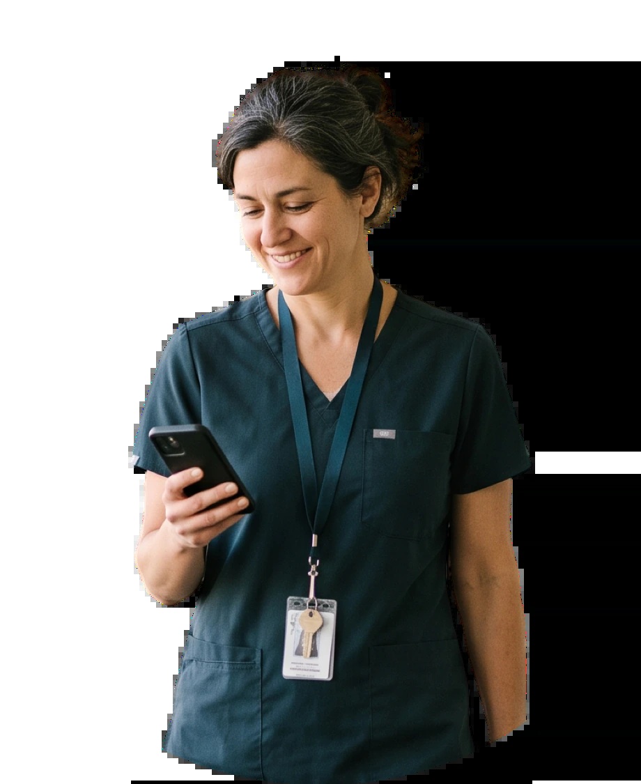 A physician looking at a mobile device in PerfectServe’s website photography