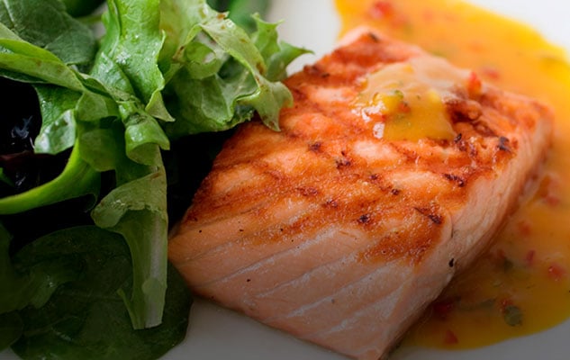 Salmon and vegetables presented on a plate in Performance Food Group’s foodservice imagery