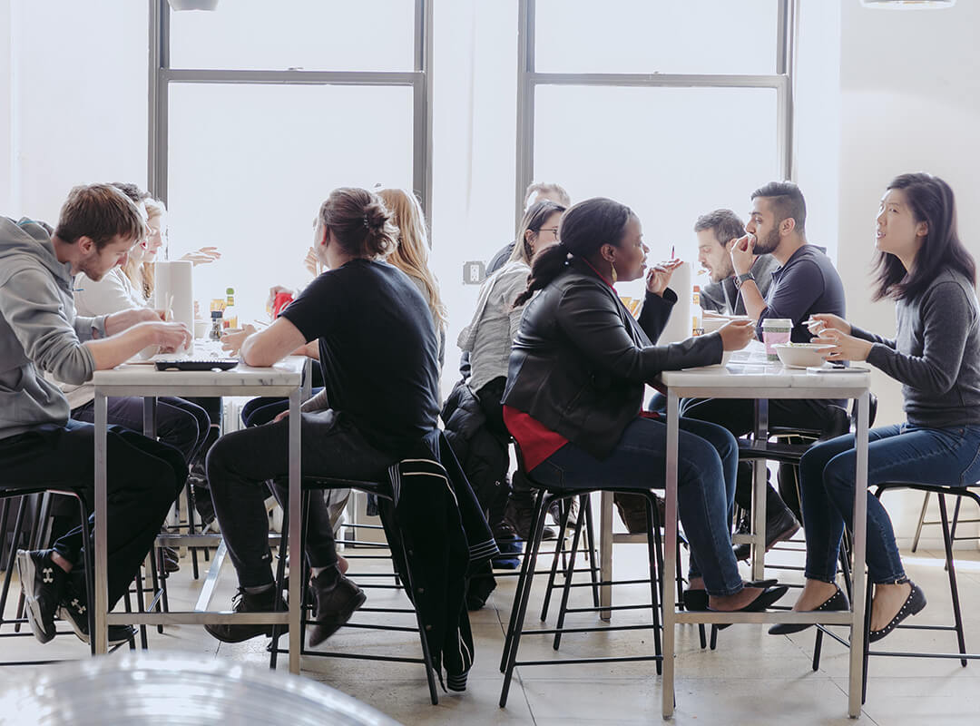 People at Persado gathered in a workplace photograph