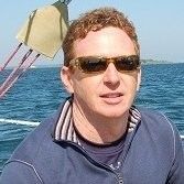 Peter Armstrong wearing sunglasses aboard a boat