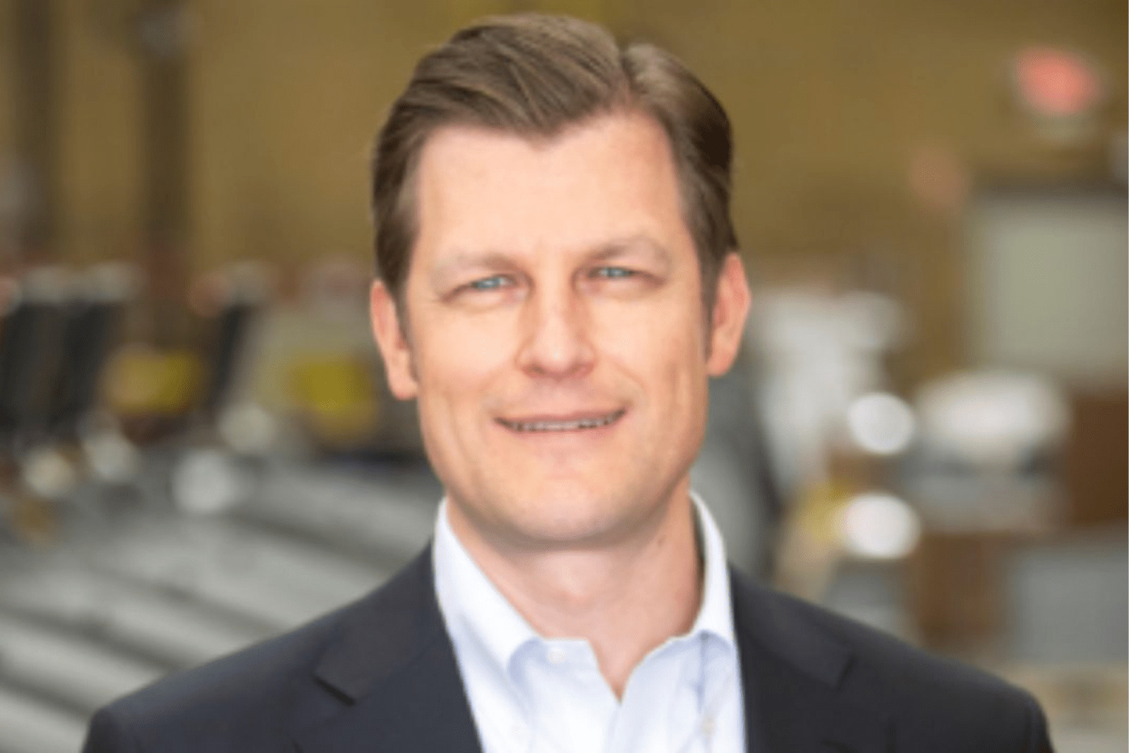Peter Arn in a dark jacket at ROMTech's facility