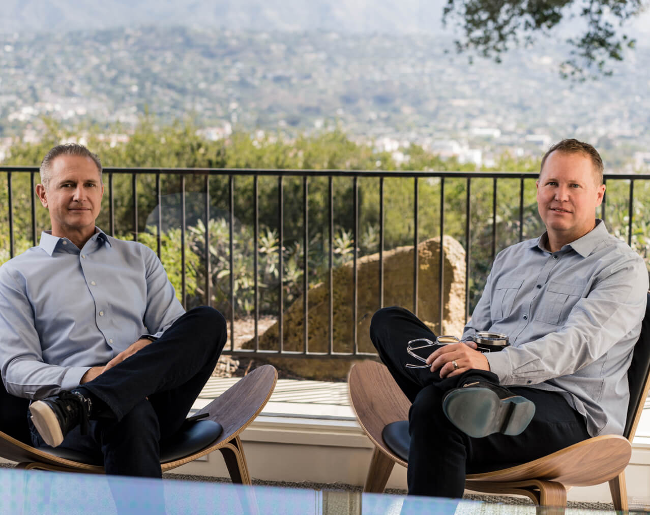 Flueid co-founders Peter Richter, left, and Peter Bowman, right, seated together