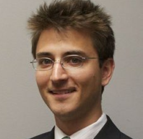 Peter Friis wearing glasses and a suit, in the photograph accompanying his 2017 interview