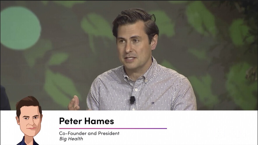 Peter Hames speaking during a filmed HLTH conference interview, wearing a striped shirt.